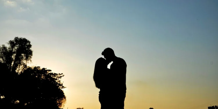 Couple in love together at sunset