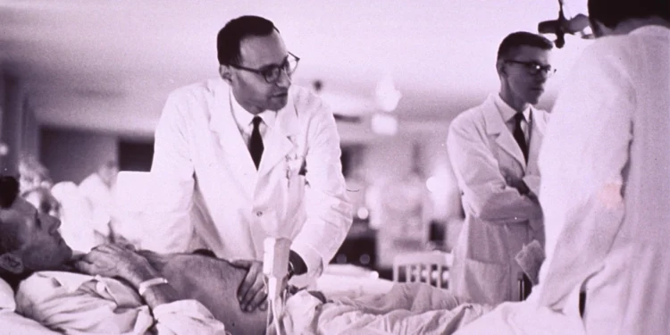 Doctor examining patient related to cleaning ears and removing ear wax safely
