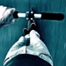 Adult riding an electric scooter like the Yume X7