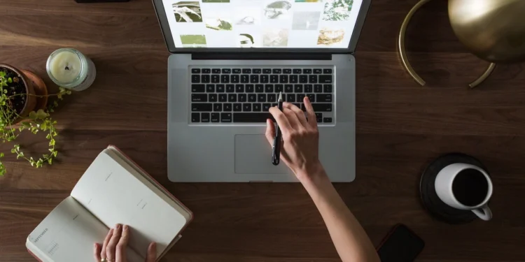 Entrepreneur working on a laptop at her desk
