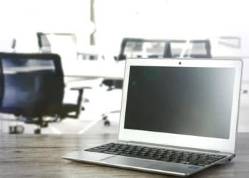 Laptop in office related to Outlook PST file risks and tips