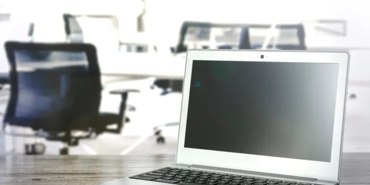 Laptop in office related to Outlook PST file risks and tips