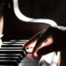 Hands playing piano related to choosing the best piano teacher near you