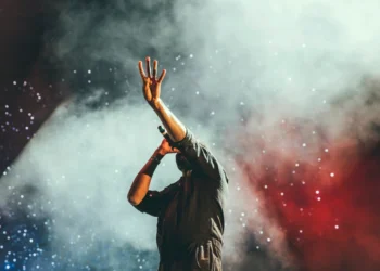 Singer on stage related to musical artist Reid Coke's new single NUMB