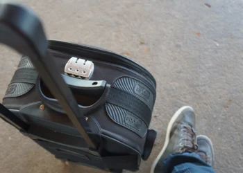 Travel suitcase packed for a student trip