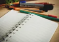 Open notebook and pens for TOGAF exam preparation