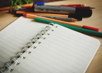 Open notebook and pens for TOGAF exam preparation