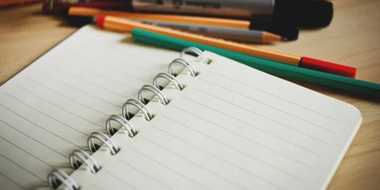 Open notebook and pens for TOGAF exam preparation