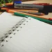 Open notebook and pens for TOGAF exam preparation