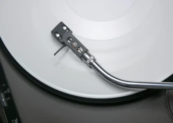 Vinyl record spinning on a turntable for a debut studio album release
