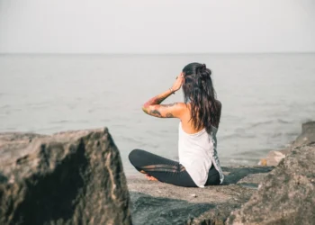 Woman sitting cross-legged and meditating