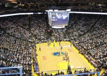 Basketball game inside a packed NBA arena