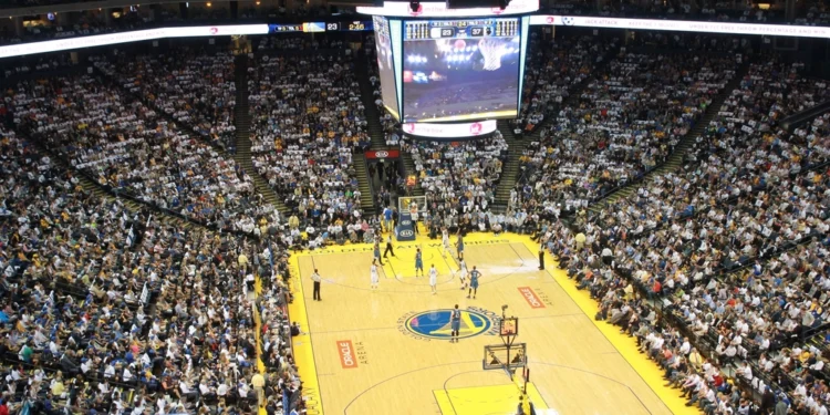 Basketball game inside a packed NBA arena