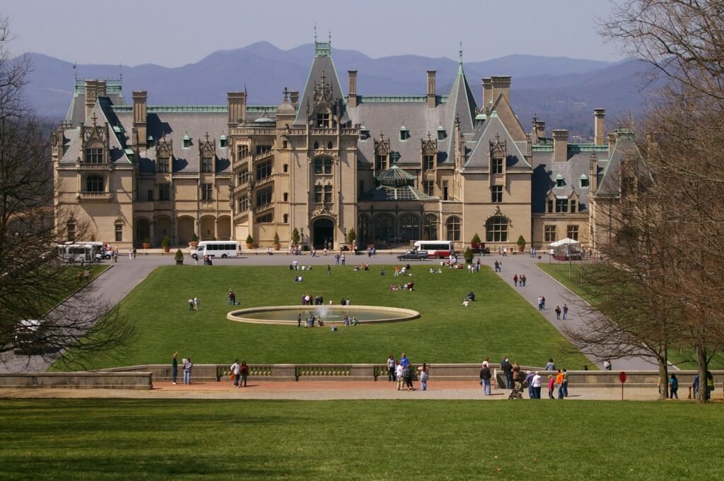 The Biltmore mansion seen from a distance across the front lawn