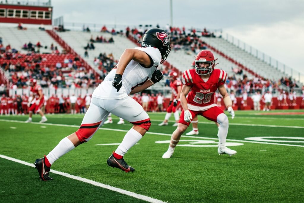 High school football players on the field during a daytime game