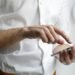 Person holding a smartphone to view Instagram anonymously
