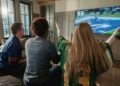 Friends watching football at home on a legal service instead of VIPStand