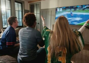 Friends watching football at home on a legal service instead of VIPStand