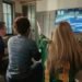 Friends watching football at home on a legal service instead of VIPStand