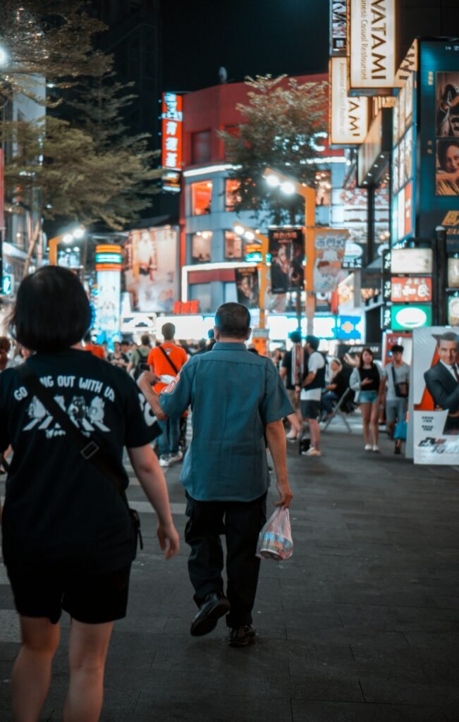 Crowds walking through Ximending in Taipei at night